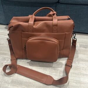 Monos Metro Duffel in Mahogany vegan leather.